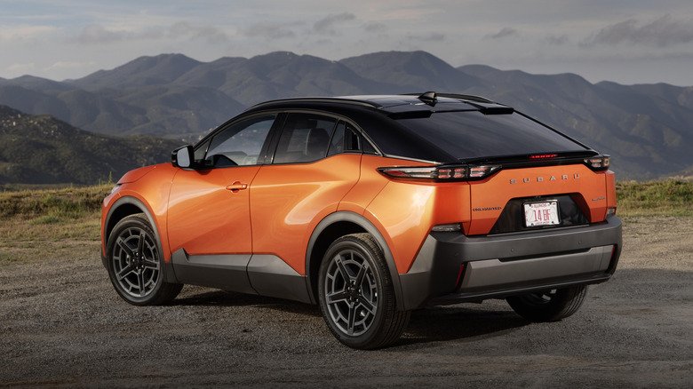 Rear 3/4 view of an orange 2026 Subaru Uncharted