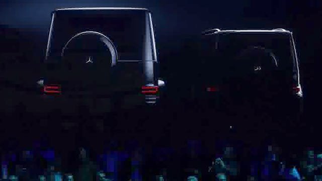 two luxury suvs displayed against a dark background